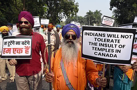 FILE- Members of Hindu Sikh Global Forum protest against the attack on a Hindu temple in Canada, near Canadian Embassy, in New Delhi on Sunday, Nov. 10, 2024.