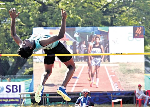 Abinav Sreeram of GHSS Kalavoor, Alappuzha, who won gold in the junior boys High Jump at the Kerala State School Sports Meet at the Maharajas College Stadium in Kochi on Sunday