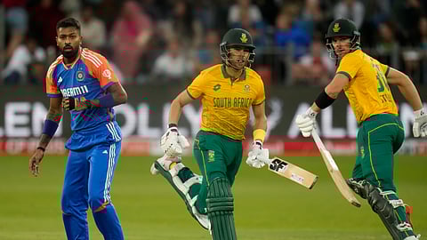 India's Hardik Pandya, left, watches the ball as South Africa's Reeza Hendricks, center, and Tristan Stubbs run between the wickets to score during the second T20 cricket match between South Africa and India at St George's Park in Gqeberha, South Africa, Sunday, Nov. 10, 2024.