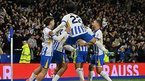 Brighton's English-born Danish midfielder #33 Matt O'Riley celebrates with teammates after scoring their second goal during the English Premier League football match between Brighton and Hove Albion and Manchester City