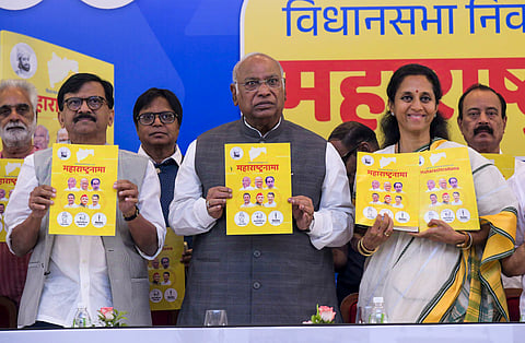 Congress President Mallikarjun Kharge, Shiv Sena (UBT) MP Sanjay Raut and NCP (SP) MP Supriya Sule release Maha Vikas Aghadi's manifesto for Maharashtra Assembly elections, in Mumbai, Sunday, Nov. 10, 2024.
