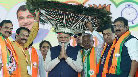 Prime Minister Narendra Modi being felicitated during a public meeting ahead of the Maharashtra Assembly elections, in Nanded district, Saturday.