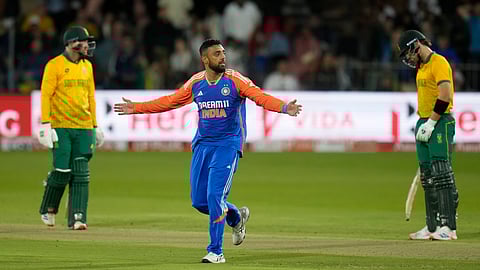 India's Varun Chakravarthy, center, celebrates the dismissal of South Africa's Heinrich Klaasen, left, during the second T20 cricket match between South Africa and India at St George's Park in Gqeberha, South Africa, Sunday, Nov. 10, 2024.