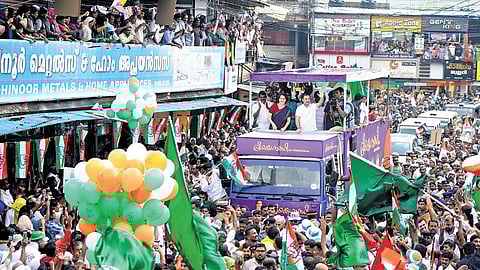 UDF candidate for Wayanad Priyanka Gandhi Vadra and her brother Rahul Gandhi greet supporters during a roadshow at Thiruvambady in Kozhikode