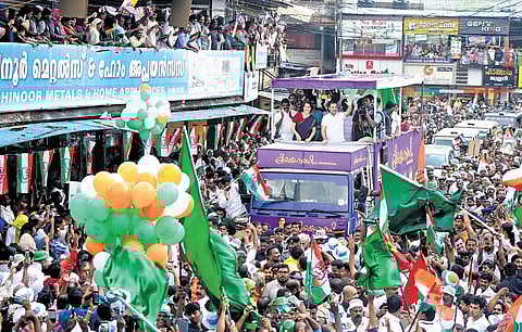 UDF candidate for Wayanad Priyanka Gandhi Vadra and her brother Rahul Gandhi greet supporters during a roadshow at Thiruvambady in Kozhikode