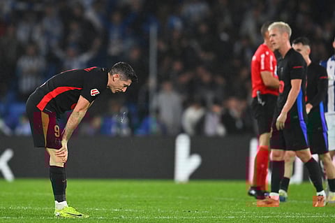 Barcelona's Robert Lewandowski reacts after the Spanish La Liga football match between Real Sociedad and Barcelona at the Anoeta stadium, in San Sebastian.