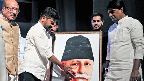 Chief Minister A Revanth Reddy pays floral tributes to Moulana Abul Kalam Azad at Ravindra Bharathi in Hyderabad on Monday