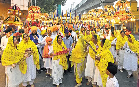 Women devotees reciting Shabad Keertans during a procession in Secunderabad on Monday