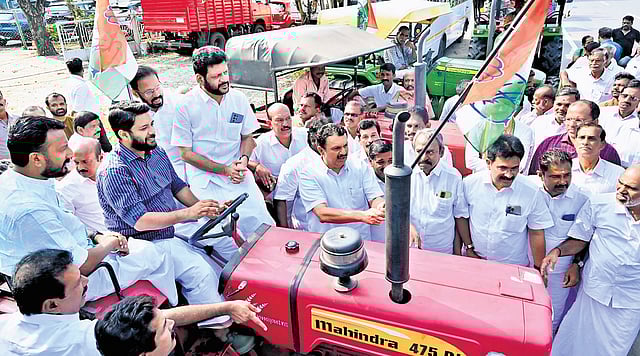 Senior Congress leader K Muraleedharan flags off the Farmer Protection Tractor March organised in Palakkad. UDF candidate Rahul Mamkootathil, MPs Shafi Parambil and V K Sreekandan, and DCC president A Thankappan are also seen