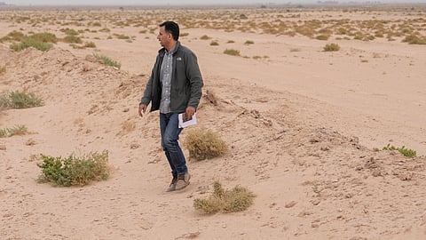 Dr Jaafar al Jotheri holds satellite images and explores the site of the Battle of al-Qadisiyah, which was fought in Mesopotamia - present-day Iraq - in the 630s AD between Arab Muslims and the army of the Sassanid Persian dynasty during a period of Muslim expansion. Abu Sakhir district- southern Najaf, Iraq, Sunday, Nov.10, 2024.