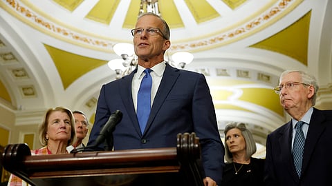 Senate Minority Whip John Thune speaks during a news conference at the US Capitol on September 10, 2024, in Washington, DC. Senate Minority Leader Mitch McConnell (R) can be seen on the side.