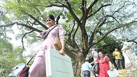 The officials returning after collecting the polling materials at the SKMJ School Kalpetta in wayanad .