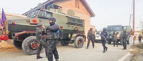 Security personnel during an encounter with militants at Badimarg area of Yaripora in Kulgam district of Jammu & Kashmir on Wednesday.