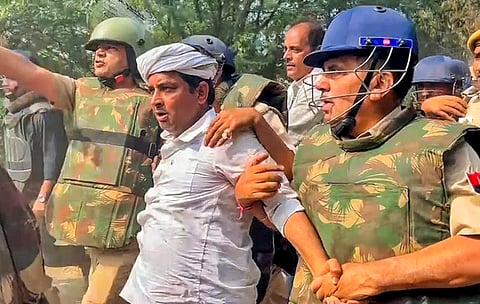 Independent candidate Naresh Meena being arrested after he had allegedly slapped Malpura SDM during Deoli-Uniara Assembly by-poll, leading to violence in the area on Wednesday, at Samravta village in Tonk district of Rajasthan, Thursday, Nov 14, 2024.