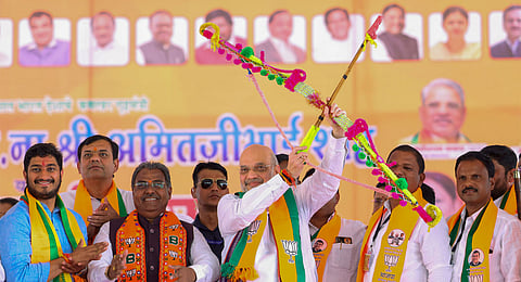 Union Home Minister Amit Shah with others during a public meeting at Sindkheda Assembly constituency ahead of Maharashtra Assembly elections, in Dhule district.