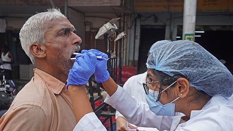 Dental students of Sri Rajiv Gandhu College of Dental Science seen checking dental hygiene of vendors, labourers and distributed dental hygiene kit at APMC yard in Bengaluru.