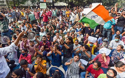 Aspirants stage a protest against the UPPSC, demanding the implementation of 'Single Day, Single Sheet' exams, in Prayagraj, Thursday, Nov. 14, 2024.