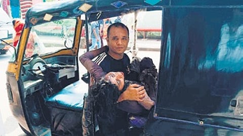 The injured woman being taken to hospital in an auto-rickshaw