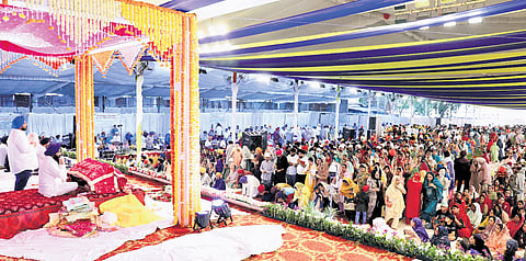 Devotees offer prayers to Sri Guru Granth Sahibji at the Exhibition Grounds in Nampally on Friday on the occasion of 555th Prakash Purab of Sri Guru Nanak Dev Ji