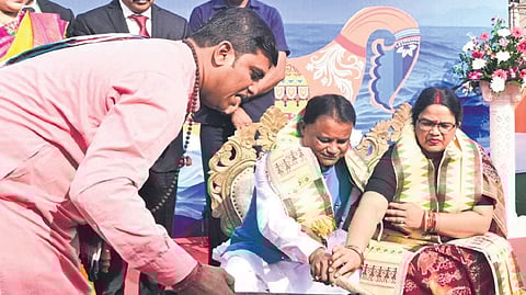 Chief Minister Mohan Charan Majhi performs a ritual with his wife Priyanka Marandi
