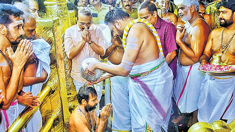 Thantri Kandararu Rajivaru performing kalasabhishekam on new melsanthi Arun Kumar Nampoothiri at Sabarimala temple on Friday