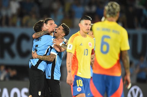 Uruguay's midfielder #05 Manuel Ugarte (L) celebrates with teammates after scoring his team third goal during the 2026 FIFA World Cup South American qualifiers football match between Uruguay and Colombiaon November 15, 2024.