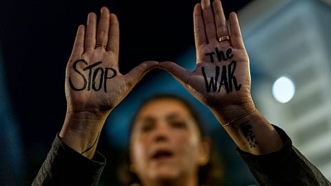 A woman shouts slogans during a protest against Prime Minister Benjamin Netanyahu's government and call for the release of hostages held in the Gaza Strip by the Hamas militant group, in Tel Aviv, Israel, Saturday, Nov. 16, 2024.