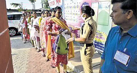Group-III examinees being checked before entering the exam centre in Karimnagar on Sunday; EXPRESS