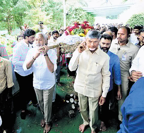 Chief Minister N Chandrababu Naidu shoulders the bier of Ramamurthy Naidu during the funeral of his younger brother at Naravaripalle on Sunday