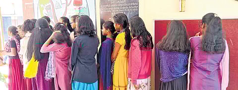 Students showing their trimmed hair in Alluri Sitarama Raju district.