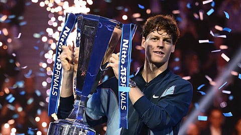Italy's Jannik Sinner lifts the trophy after winning the final against USA's Taylor Fritz at the ATP Finals tennis tournament in Turin on November 17, 2024.