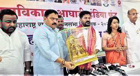 Maharashtra Congress leaders present a Chhatrapati Shivaji statuette to Chief Minister A Revanth Reddy during the election campaign in Pune on Monday