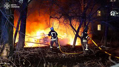 In this photo provided by the Ukrainian Emergency Service, firefighters extinguish the fire following a Russian rocket attack that hit a multi-storey apartment building in Sumy, Ukraine, Sunday, Nov. 17, 2024.