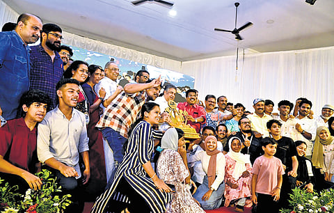Students from Malappuram receive the Education Minister’s Trophy after they were crowned overall champions of the State School Science Fair in Alappuzha on Sunday. Cultural Affairs Minister Saji Cherian is also seen.