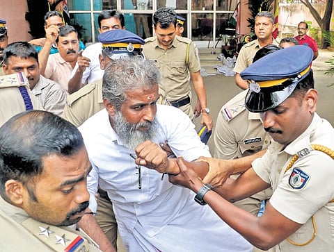 Police personnel removed Transport Democratic Federation (TDF) workers who protested in front of the KSRTC headquarters against non-payment of salaries.