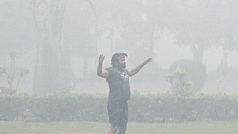 A man exercising in Lodhi Garden amid thick smog on Monday.