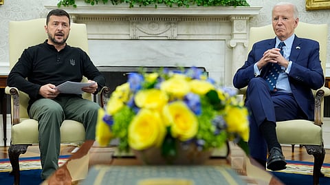 President Joe Biden, right, listens as Ukraine's President Volodymyr Zelenskyy, left, speaks during their meeting in the Oval Office of the White House in Washington, Sept. 26, 2024.
