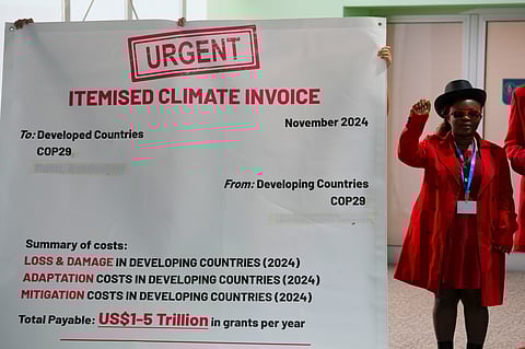 Activists participate in a demonstration for climate finance at the COP29 U.N. Climate Summit, Tuesday, Nov. 19, 2024, in Baku, Azerbaijan.