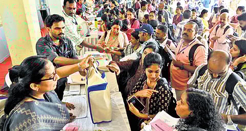Electoral officers collecting polling materials at Government Victoria College in Palakkad on Tuesday