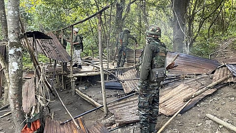 Security personnel demolish a barrack during an operation in a sensitive area of Manipur on Monday, Nov.18, 2024.