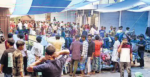 Sunday market at Perumbavoor teems with migrant workers engaged in weekend shopping
