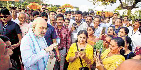 Union Home Minister Amit Shah interacts with locals after inaugurating the ‘Rajnikant Shroff Sarovar and Udyan’ in Ahmedabad on Tuesday.