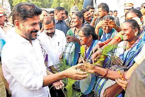 Chief Minister A Revanth Reddy interacts with artistes during the Praja Palana-Vijayotsavalu fete organised by the state government in Warangal on Tuesday