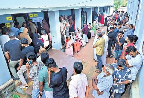 Voters awaiting their turn at a polling booth at Government High School in Vennakkara, Palakkad on Wednesday