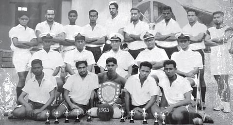 Jayan (standing third from right in the third row) with his colleagues and senior
naval officials