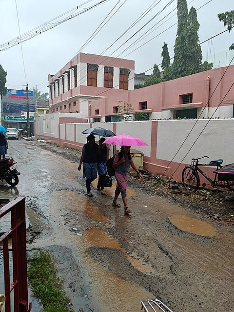 Students on their way to school in the rain in Nagapattinam on Wednesday