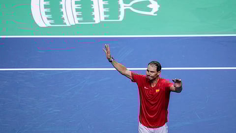 Spain's tennis player Rafael Nadal waves to the crowd after losing against the Netherlands' Botic Van De Zandschulp during a Davis Cup quarterfinal match at Martin Carpena Sports Hall in Malaga, southern Spain, on Tuesday, Nov. 19, 2024.