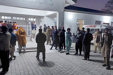Local residents and volunteers gather and wait for the arrival of victims of gunmen firing incident on passenger vehicles, at a hospital in Parachinar, in Kurram district of Pakistan's northwestern Khyber Pakhtunkhwa province, Thursday, Nov. 21, 2024.
