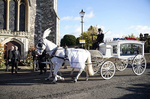 A horse-drawn carriage carrying the coffin of Liam Payne arrives for the funeral service of the One Direction singer
