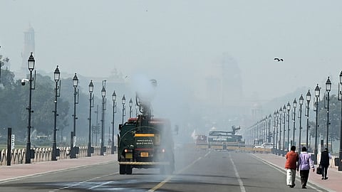 An Anti smog truck spraying mist to settle down the dust particles